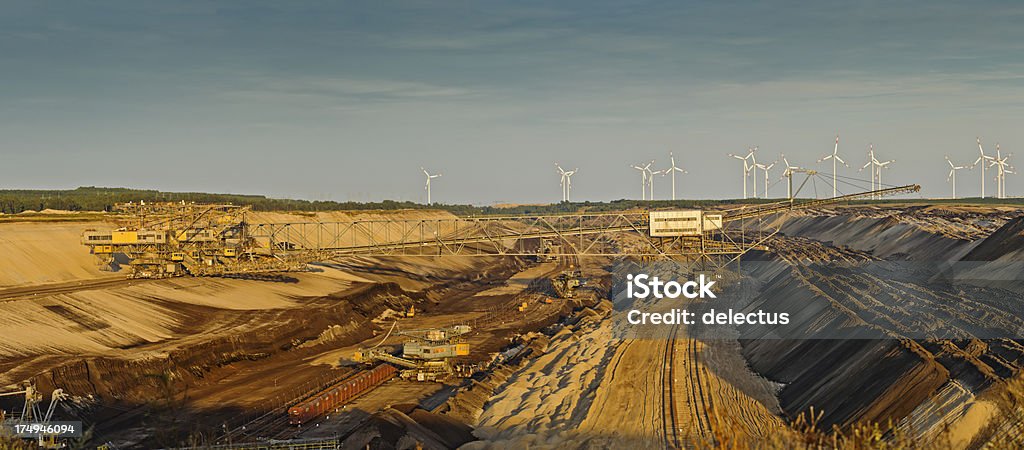 panorama brown coal opencast mining panorama of a brown coal opencast mining, just before sunset, Germany, Cottbus.  Mining - Natural Resources Stock Photo