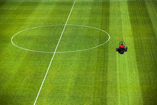 istock Cutting grass turf lines on a sports field 174946107