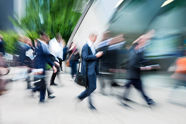 istock Business Commuters Walking in Financial District, Blurred Motion, London, UK 174946192