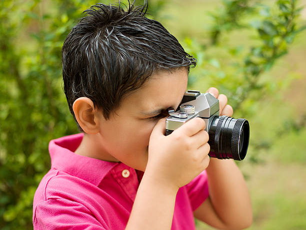 istock Little boy photographer 174946272