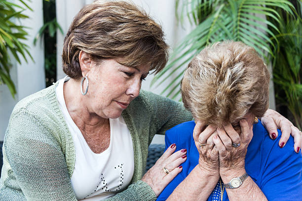 istock Consoling an elderly woman 174946304