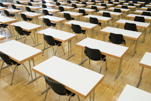 Empty seats at an examination room.