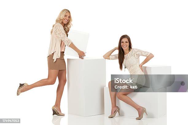 Two Attractive Females With Cardboard Boxes Stock Photo - Download Image Now - 20-29 Years, Adult, Adults Only