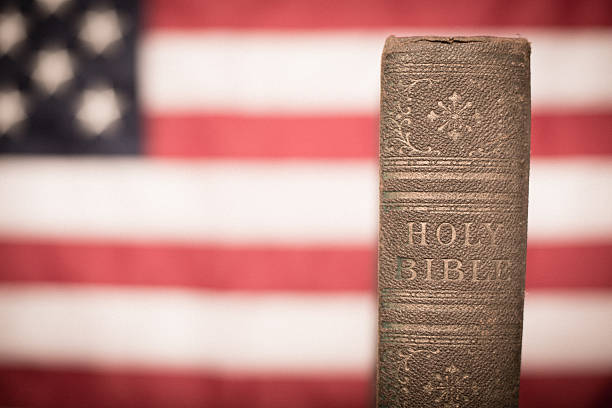istock Old, Ornate Holy Bible With American Flag Background 174947063