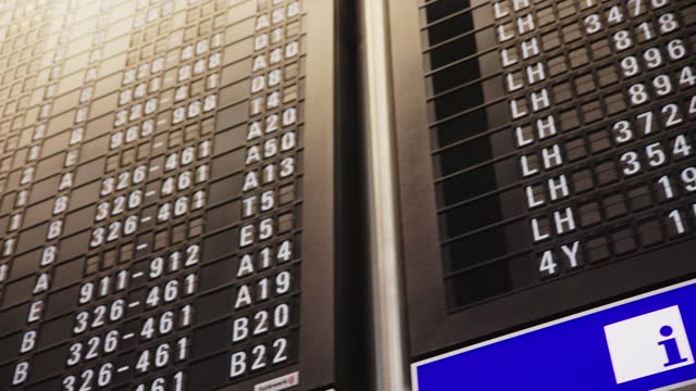 Black analog departure scoreboard at the airport