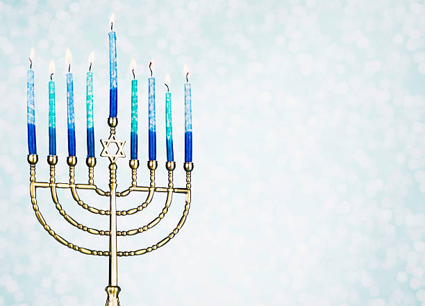 Menorah With Burning Candles Menorah With Burning Candles and Copy Space hanukkah candles stock pictures, royalty-free photos & images