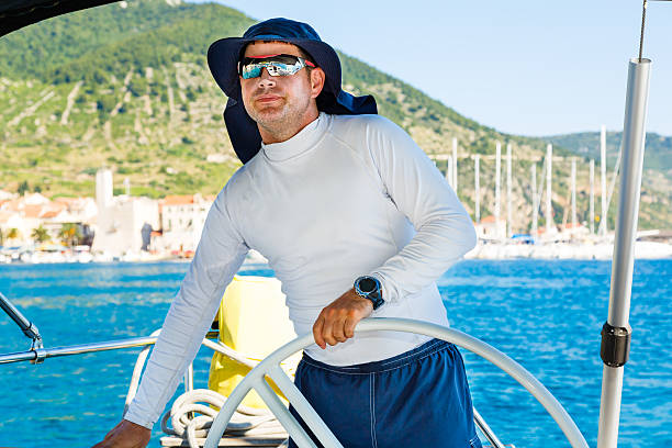 istock Skipper sailing with sailboat 174947952