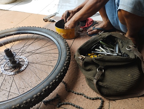 A mechanic is fixing my bike