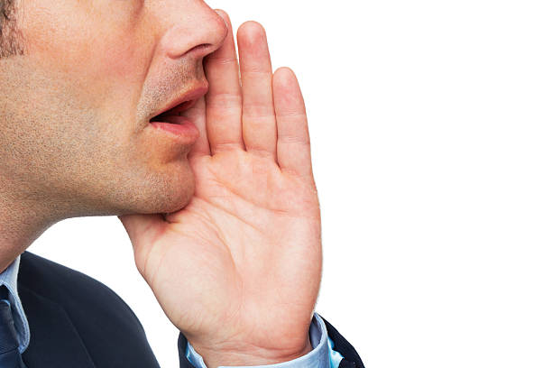 Unrecognizable caucasian man screaming in rage and anger with copy space and yellow background