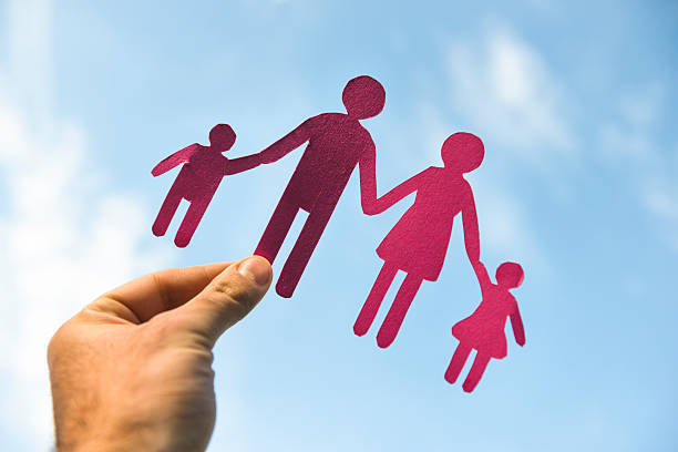 istock Family paper dolls against the sky 174948686