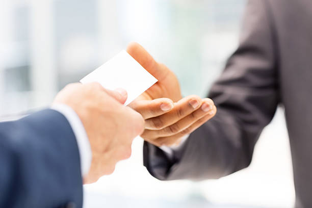 istock Businessman Giving Business Card To Client 174948762