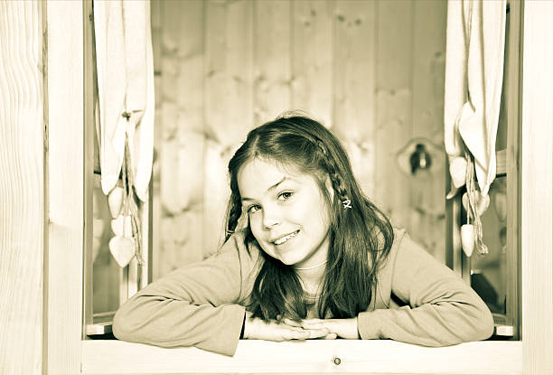 istock Girl on a indow 174948926