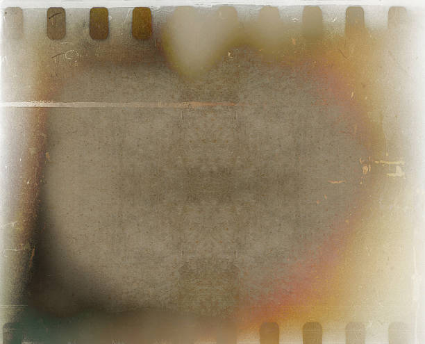 istock brown mottled background with film strip 174948989