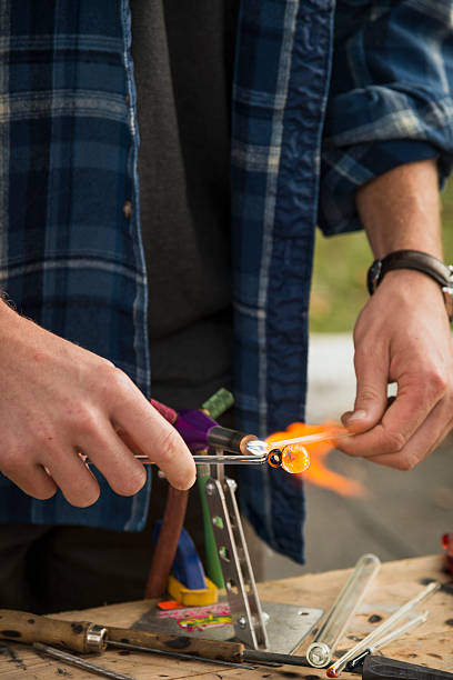 istock Hands of a Glass Artist Working on Pendant Vertical 174949199