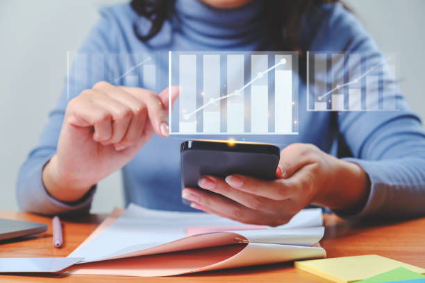 istock Businesswoman analyzing growing chart floating above digital tablet computer screen, showing successful increase in business profit 1749494578
