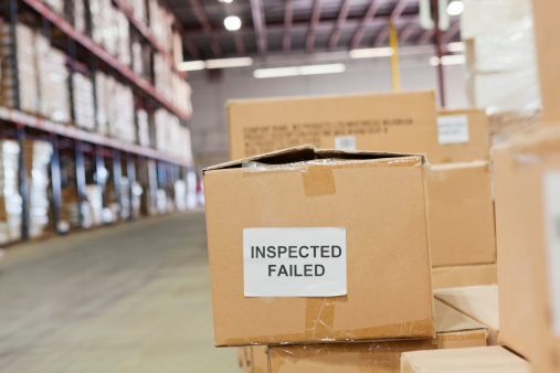 Boxes of products failed inspection at shipping distribution warehouse