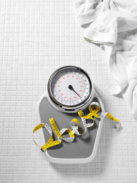 istock Obese on Bathroom Scales 174949944