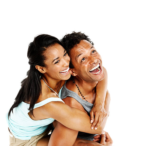 istock Smiling man piggybacking his girlfriend 174950015