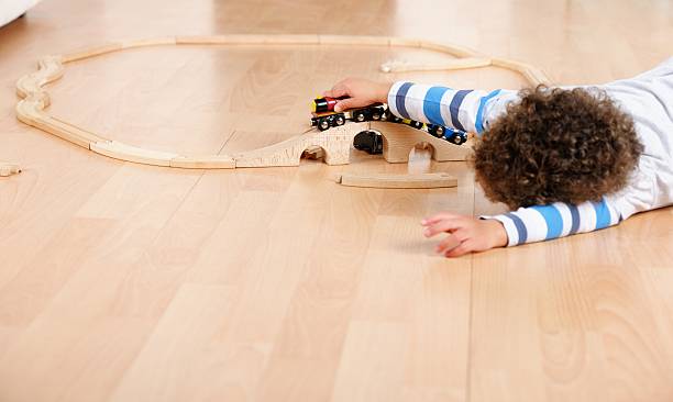 istock Toddler/ Little Boy Playing With Train Set 174950017