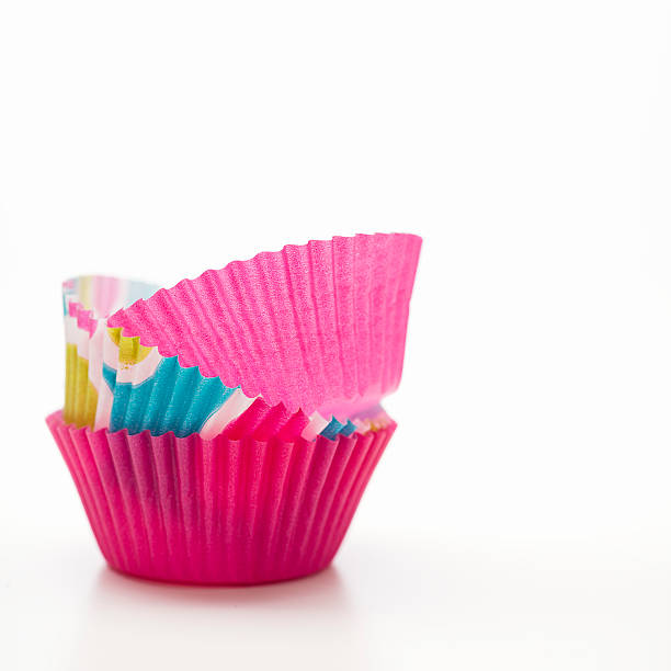 istock Stack of Pink and Turquoise Cupcake Liners with Copy Space 174950153