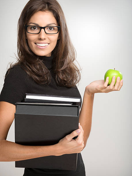 istock Beautiful Female with Books and Apple (XXXL) 174950288