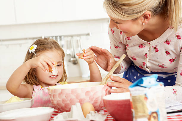 istock Mother And Daughter Baking In Kitchen 174950367