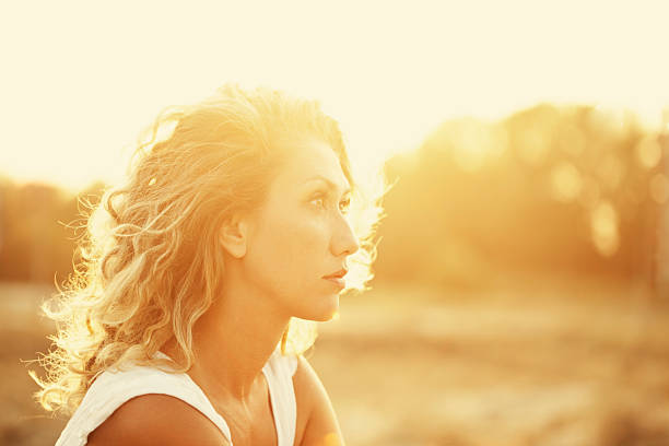 istock beautiful woman and sunbeams 174950374