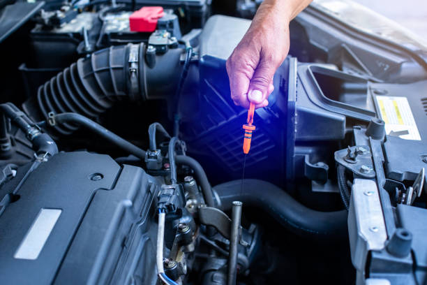 istock Check the oil level in car engine. Mechanic checking car engine or vehicle. Check and maintenance car with yourself. 1749503819