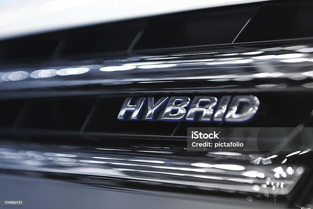 Hybrid Car Engine Hybrid Word Written on car grill filtered to chrome and blue cold colors..Car Related Images.. Hybrid Car Stock Photo