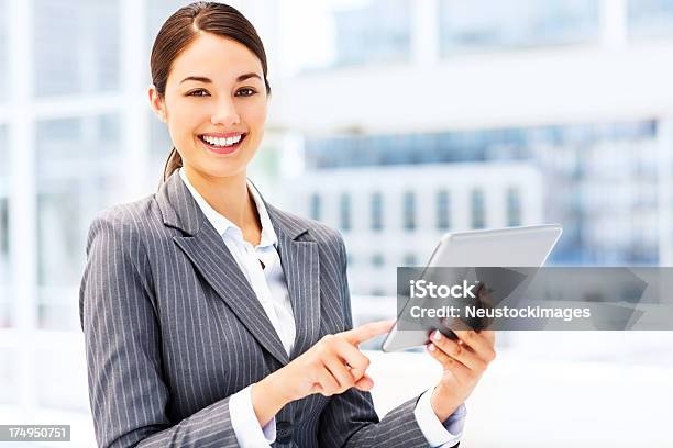 Businesswoman Using Digital Tablet Stock Photo - Download Image Now - 20-29 Years, Adult, Adults Only