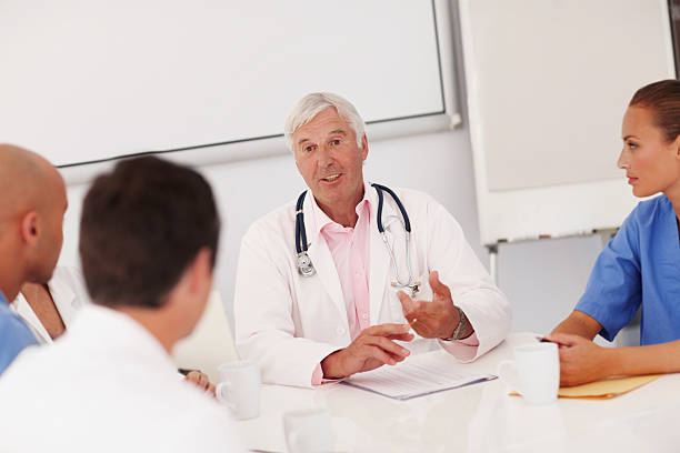 istock Meeting to discuss new medical practices 174950762