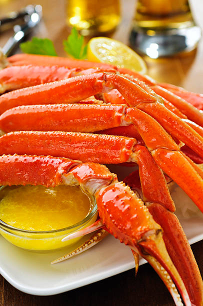 Crab Legs Fresh plate of snow crab.  Please see my portfolio for other food related images. crab leg stock pictures, royalty-free photos & images