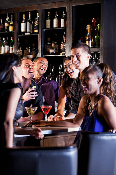 istock A group of friends enjoying drinks at bar 174951485