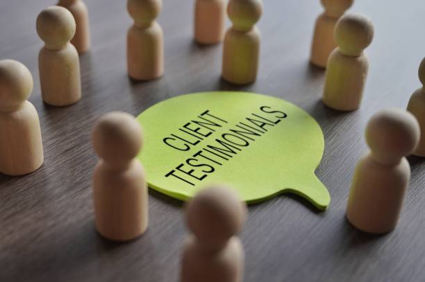 istock A group of wooden figurines surrounding a speech bubble with text CLIENT TESTIMONIALS. 1749515099
