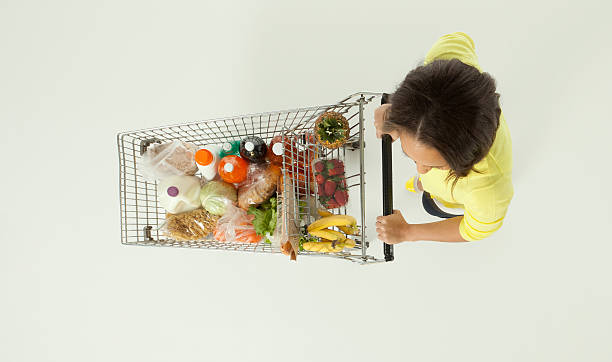 istock Woman pushing a shopping cart 174952200