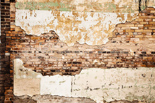 istock Grunge white brick wall with stucco 174952390