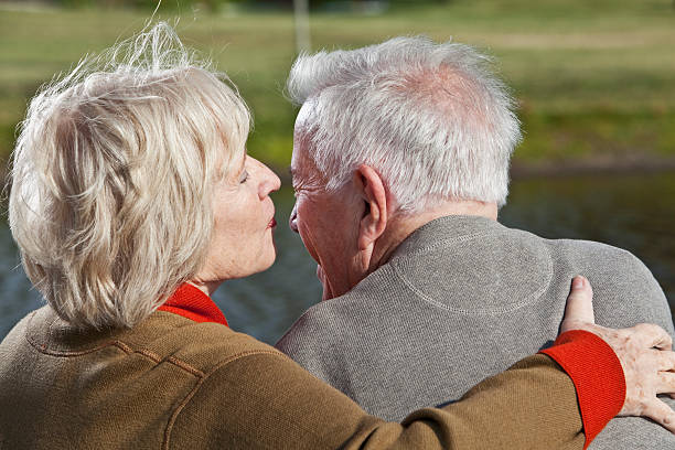 istock Senior couple whispering 174952426