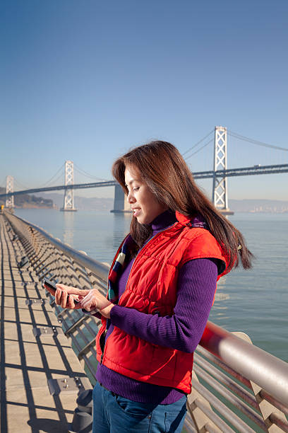 istock Women on the Phone Bay Bridge 174952428