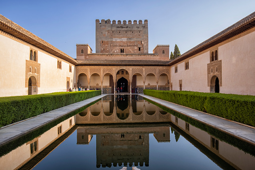 Palacios Nazaries, a part of the Alhambra in Granada, Spain. Reflection in water.