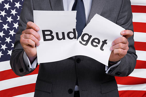 Businessman Businessman tearing word Budget uncle sam broke stock pictures, royalty-free photos & images