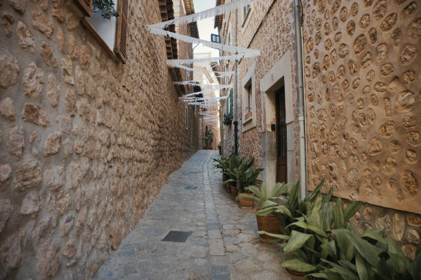 Street in capdepera with view on the castle