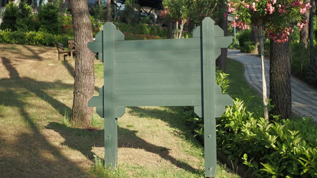 wooden sign in the a park with copy space concept.