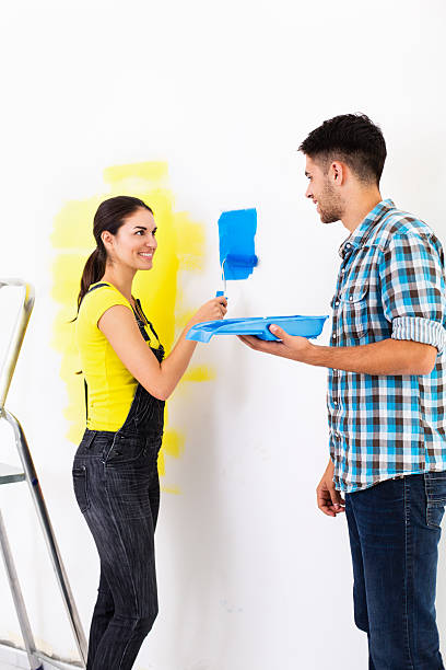 istock Couple painting a wall 174953447