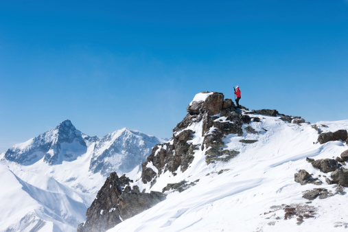 Skier climbing at top of the snowy mountainSEE ALSO: