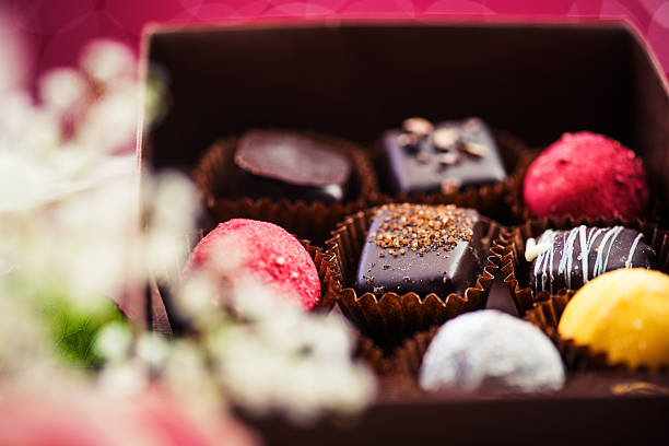 Beautiful Chocolate And Roses Stock Photo - Download Image Now - Chocolate,  Chocolate Truffle, Luxury - iStock