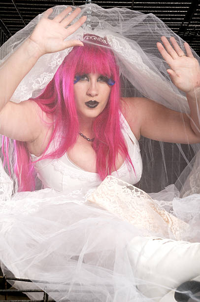 istock Pink haired bride under veil in dog crate. 174955162