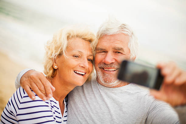 istock Smiling seniors taking photos 174955284