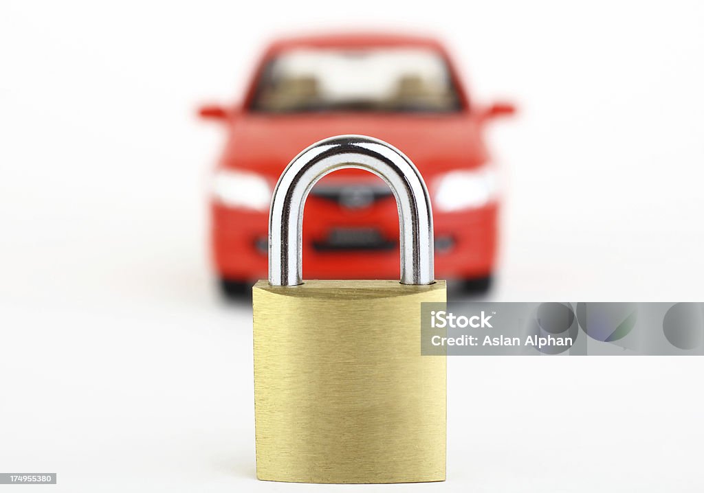 Lock in front of blurred red car Car Security Abstract Stock Photo