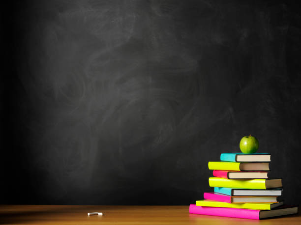 istock Books and Apple on the Desk with a Blackboard 174955398