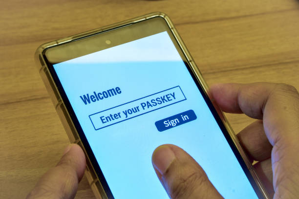 istock Woman using her phone with the digital display message enter your PASSKEY. Sign in page, passwordless login method for more security. 1749554437